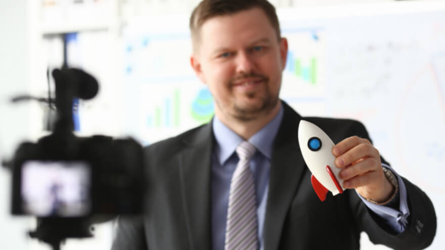A business owner is recording a video for its successful activity