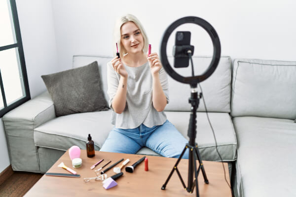 A marketing influencer is recording an UGC portrait video