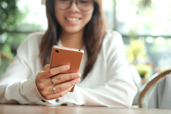 A woman is browsing a website on mobile