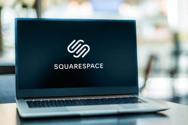 A laptop screen is showcasing the Squarespace's logo