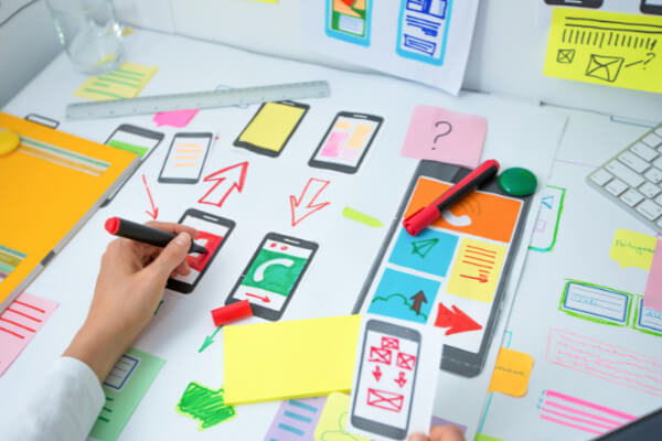 A professional UX designer is working on a mobile app