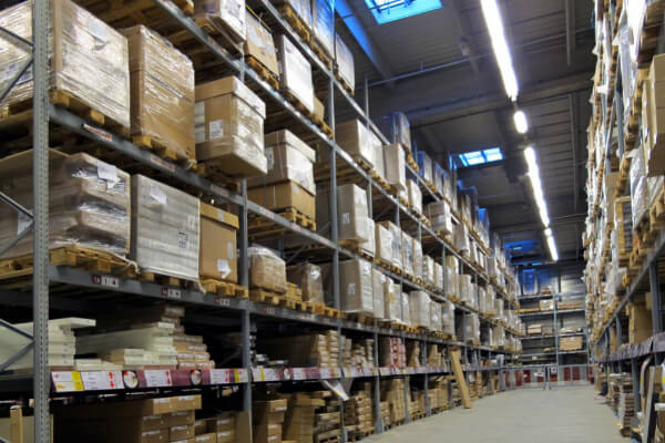 A warehouse alley full of pallets