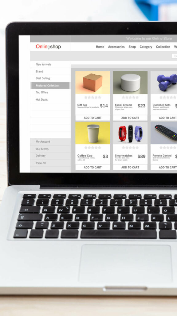 An e-commerce online shop is showcased on a laptop