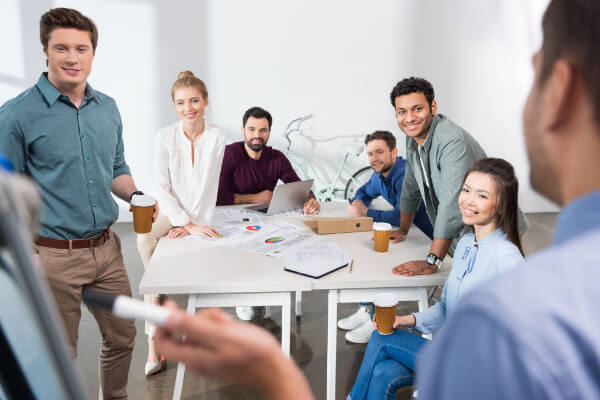 A group of professionals in an office business meeting