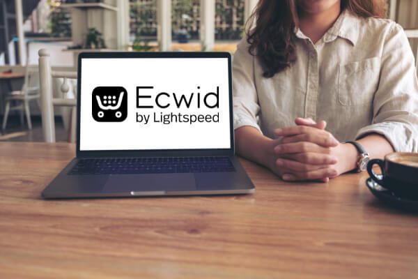 A laptop mockup showing Ecwid logo