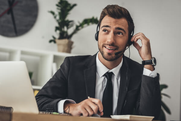 A professional sales is hanging a call with a mic