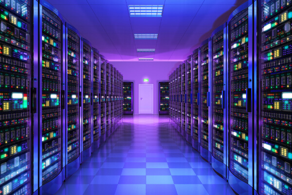 A wide-angle, hyper-realistic, and brightly lit image of a data center corridor with two long rows of modern servers, supercomputers, and networking equipment glowing with colorful blue, green, and red lights. The aisle has a tiled floor, and a closed emergency exit door is visible at the end.