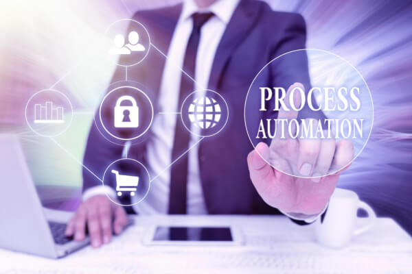 A professional in a suit touching a transparent digital screen displaying the words Process Automation and secure network icons.