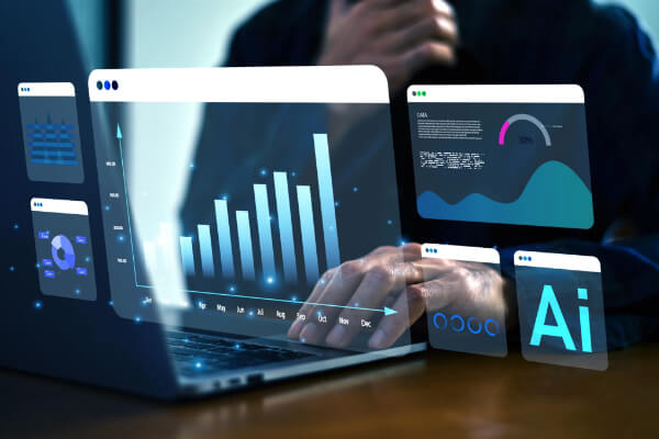 A person using a laptop with glowing transparent digital dashboard modules and AI analytics charts floating above the screen.